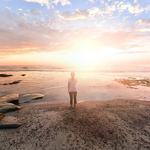 woman setting goals and writing a vision